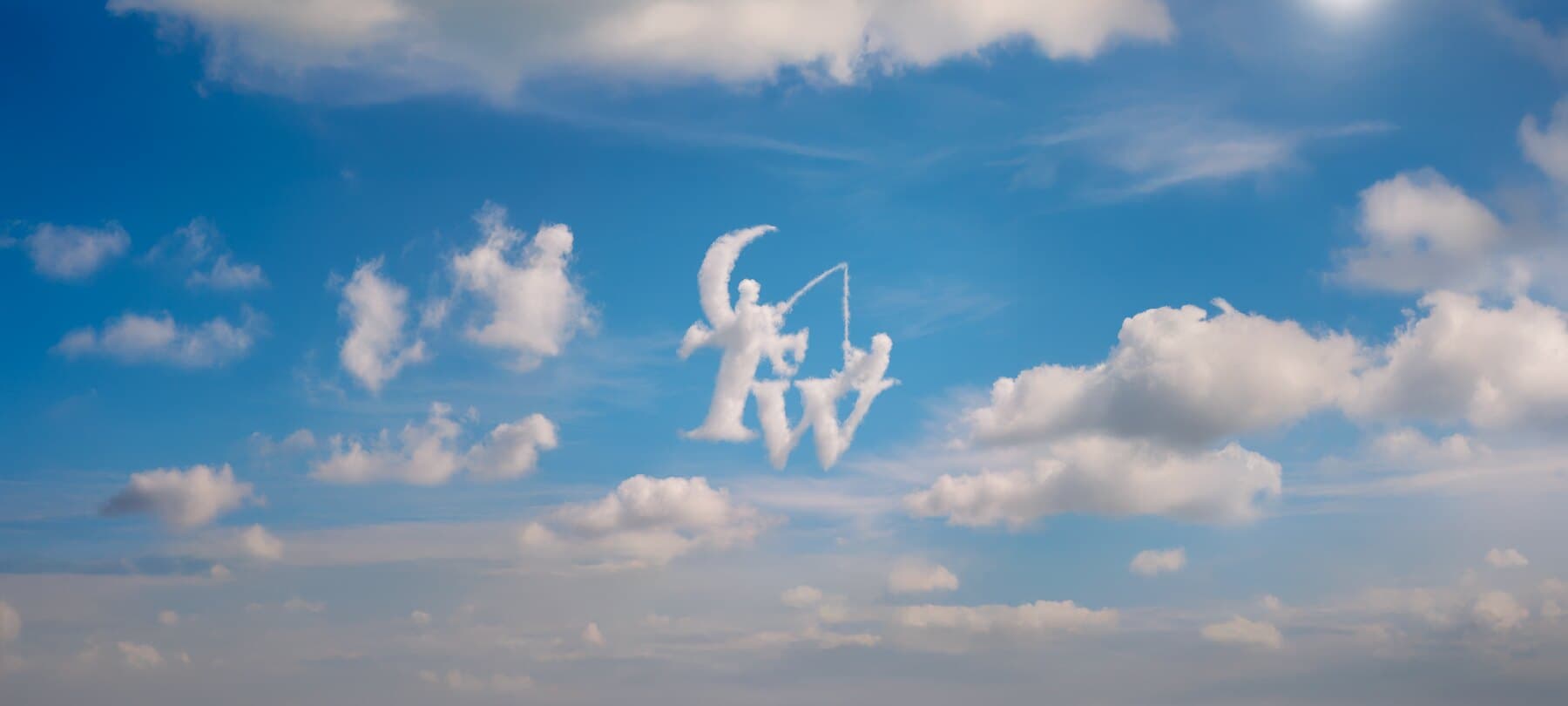 Le logo TeammWorks dessiné dans les nuages d’un ciel bleu